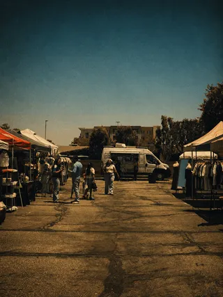 Evening food market in Downey, California with palm trees at dusk